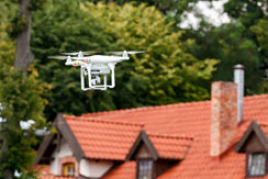 Drone being used in real estate flying above a home